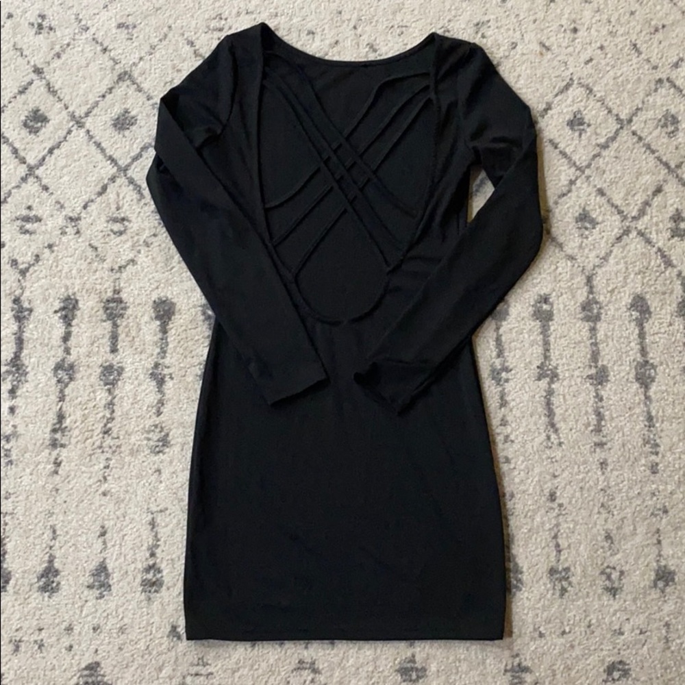 Black tight open back dress.